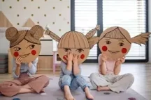 Three children expressing distinct emotions representing different aspects of child psychology